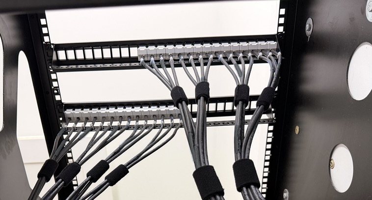 Patch panels terminated with cable bundles dressed in velcro